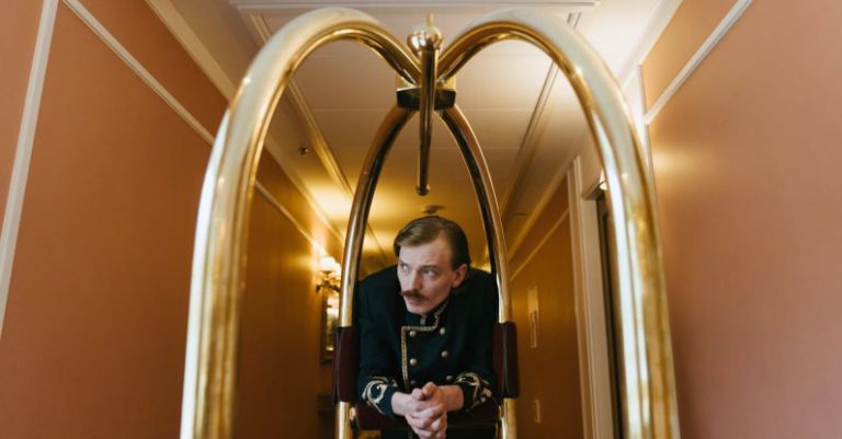 Hotel - Porter leaning on a Trolley