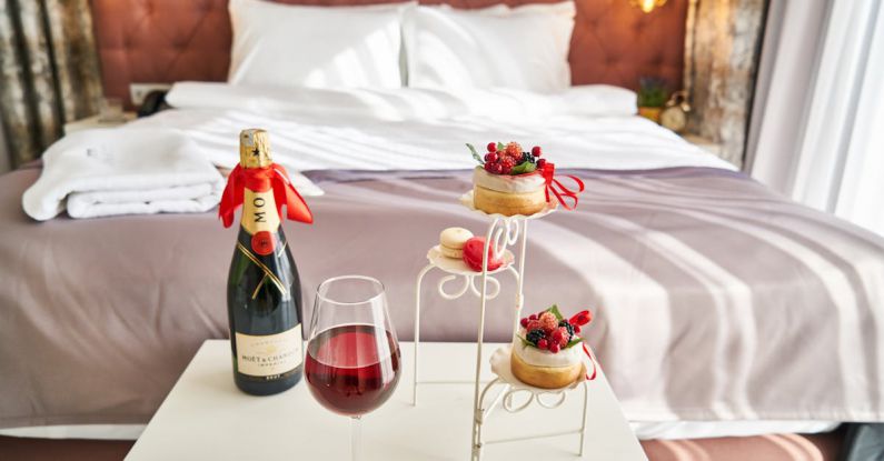 Hotel - Photo of Wine Bottle And Food On Table