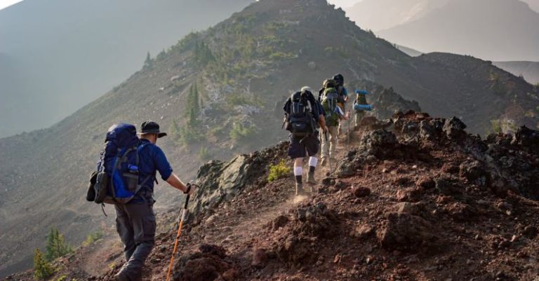 Adventure - Group of Person Walking in Mountain