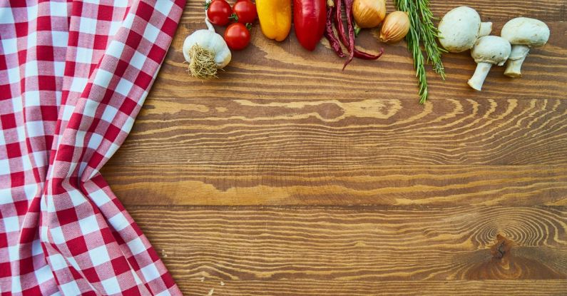 Cuisine - Assorted Spices on Brown Wooden Table Beside Red and White Textile