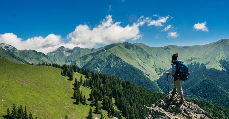 Hiking - Man Standing on a Rock